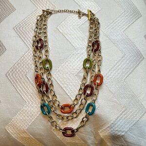 Layered chain link necklace with gold and jewel tone links